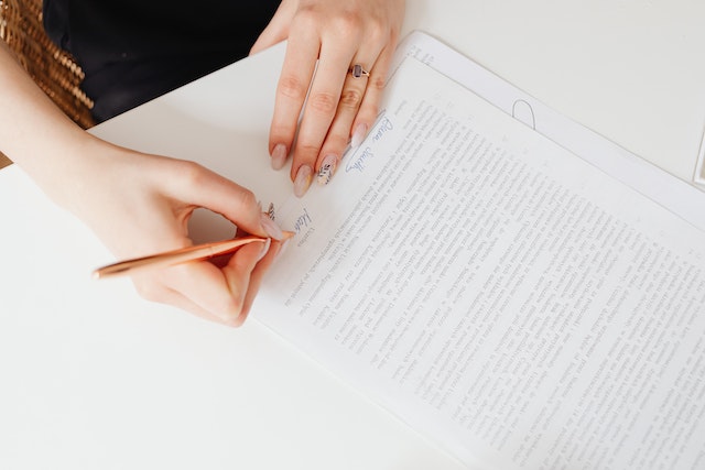 woman signing lease agreement papers